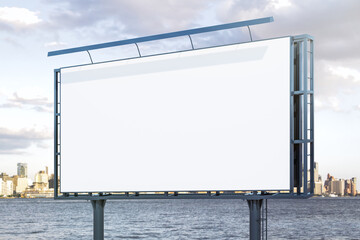 Blank white billboard on city buildings background at daytime, perspective view. Mockup, advertising concept