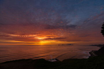 Miraflores, a district located in Lima, Peru, offers breathtaking sunset views along its coastline facing the Pacific Ocean