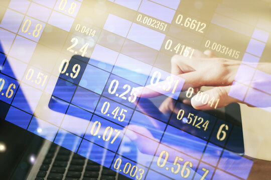 Abstract creative analytics data spreadsheet with finger clicks on a digital tablet on background, analytics and analysis concept. Multiexposure