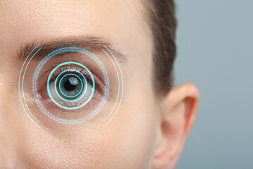 Vision test. Woman and digital scheme focused on her eye against grey background, closeup - obrazy, fototapety, plakaty