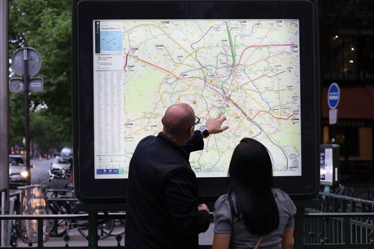 paris france , 08 08 2024 : people looking at a metro map