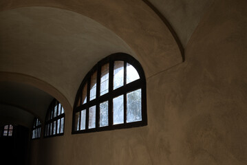 a window as the only light point in a basement