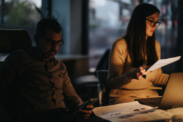 Business employee discussing growth, planning for opportunities, and working on tasks in an office.