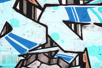 Colorful background of graffiti painting artwork with bright aerosol outlines on wall. Old school...