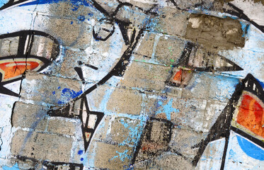 Colorful background of graffiti painting artwork with bright aerosol outlines on wall. Old school street art piece made with aerosol spray paint cans. Contemporary youth culture backdrop