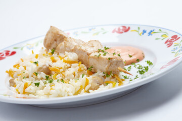 rice with chicken kebab and sauce