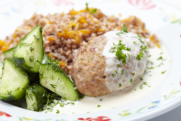 buckwheat with cutlet and sauce