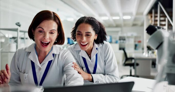 Scientist, women and high five at lab with laptop, excited and solution with study results in clinic. People, cheers and celebration for innovation, goals and breakthrough in test at pharma company