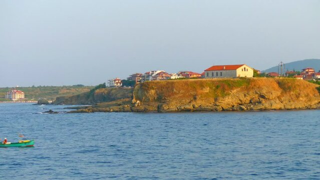 TSAREV, BULGARIA - JULE 29 2016: Black Sea coast near the town of Tsarev, Bulgaria. Boat sails with fishermen.