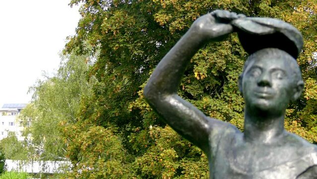 POTSDAM, GERMANY - SEPTEMBER 10 2016: Metal sculpture of a young man on Friendship Island in Potsdam, Germany