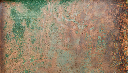 Obraz na płótnie Canvas Aged copper plate texture with green patina stains. Old worn metal background.