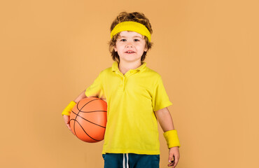 Sport for children. Little basketball player in sports uniform with game ball. Healthy lifestyle,...