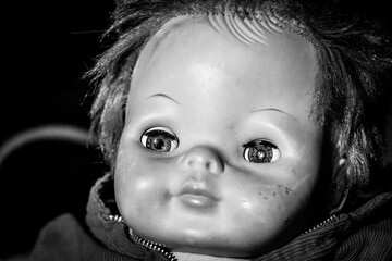 Scary and creeping doll close-up of face