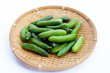 Mini cucumbers on white background.