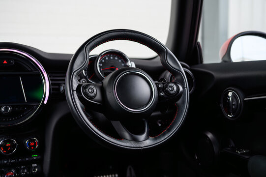 Compact car interior and steering wheel