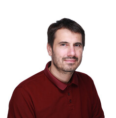 Fototapeta premium A picture of a man with a beard, mustache and fashionable hairstyle, dressed in a casual polo shirt, posing in a studio with a serious expression on a light background