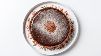 Plate of dessert featuring Sichuan chocolate tart from ByClio Bakery, arranged on a white round...