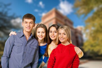 Group of happy young students at campus together