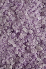 coarse lavender sea salt for bath on purple background