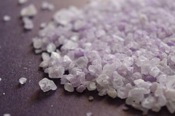 coarse lavender sea salt for bath on purple background