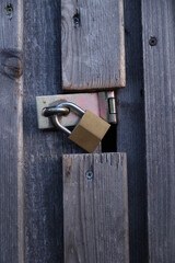 A wooden door with a lock on it - 751004017