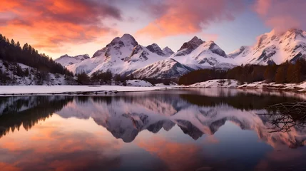 Foto auf Leinwand Panoramic view of snow covered mountains reflected in lake at sunset © Iman