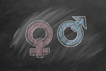 Female symbol and male symbol on blackboard. Chalk drawn illustration. Concept of love.