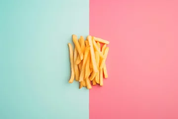Foto op Aluminium Fries on Pastel Background, simplicity, beloved snack, minimalistic arrangement, classic fast-food © asura