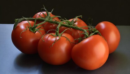 a bunch of fresh juicy red ripe tomatoes on the vine isolated against a transparent background