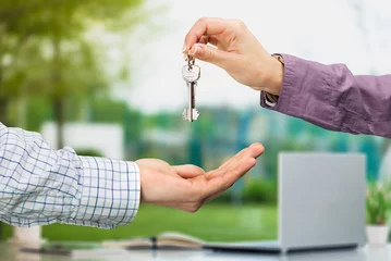 Fotobehang Officer gives keys from the house to client, real estate © BillionPhotos.com