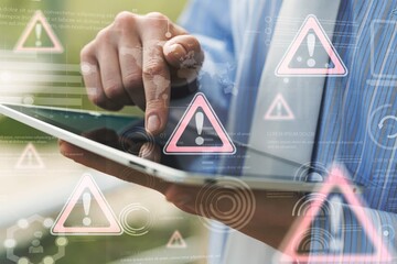 Business person using tablet computer with hologram