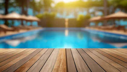 Empty wood table top and blurred swimming pool in tropical resort in summer banner background - can used for display or montage your products