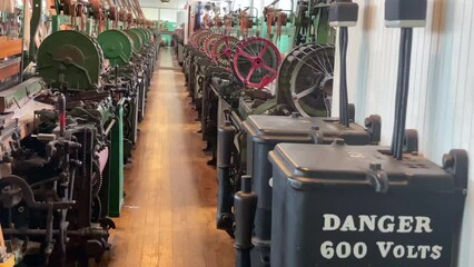 Lowell, Massachusetts: Lowell National Historical Park celebrates era of textile manufacturing during the Industrial Revolution. Boott Cotton Mills Museum recreated weave room. Weaving machine bobbin.