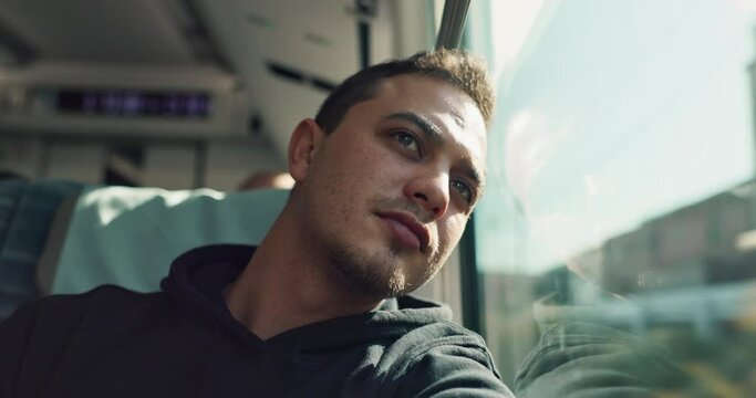 Thinking, sad and young man on train with mental health problem or loneliness on trip or journey. Depression, upset and male person from Canada on public transportation for vacation or holiday.