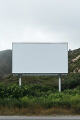 a billboard in the middle of a hill