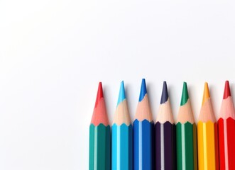 a group of colored pencils
