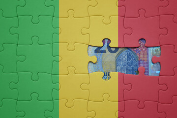 puzzle with the national flag of mali and euro banknote. finance concept