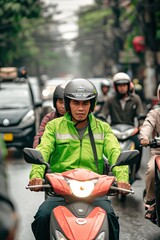  an Indonesian men working as online motorcycle taxi driver in green color safety driving clothing