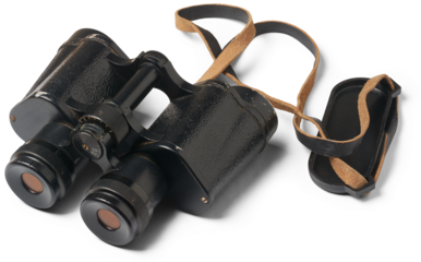 set of old classic black binoculars with metal housing and anti-reflective coating on the lenses used for activities such as birdwatching, hunting or military observation, isolated on white background