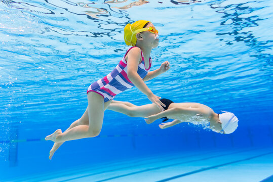 kids swimming underwater