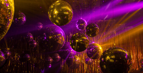 abstract disco background with mirror balls and colored rays of light - 751033469
