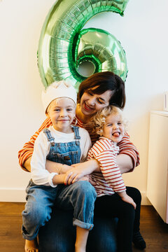 Mother with her son and daughter on 6th birthday celebration