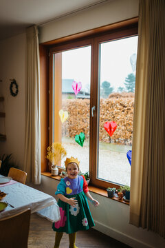Girl ready for a birthday party at home