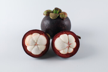 Mangosteen isolated on white background. Known as The Queen of Fruits, asia fruits concept. Sweet tropical fruit.