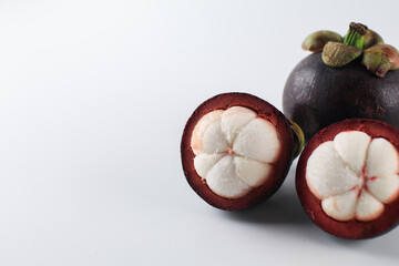Mangosteen isolated on white background. Known as The Queen of Fruits, asia fruits concept. Sweet...