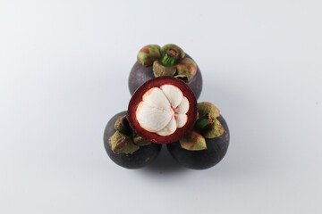 Mangosteen isolated on white background. Known as The Queen of Fruits, asia fruits concept. Sweet tropical fruit.