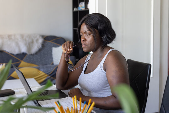 focused woman working from home, thinking, online education, get stuck