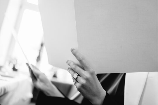Woman checking menu in cafe during break
