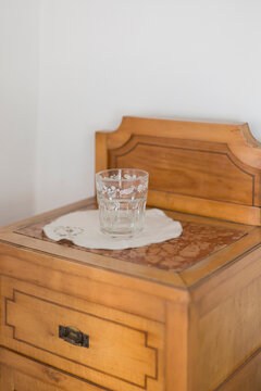 glass of water on a bedside table