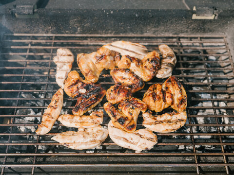 Chicken cooking at the grill